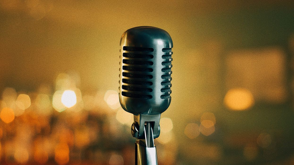 a black microphone with a blurry background