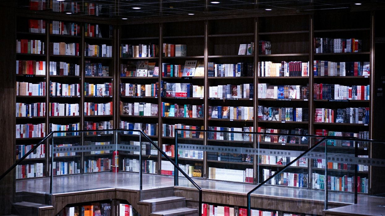 a room with shelves and books