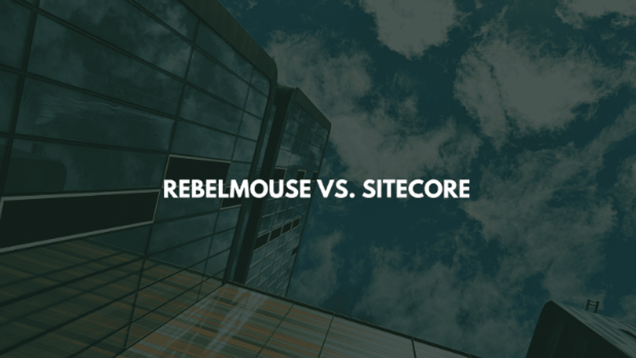 Glass building with text "Rebelmouse vs. Sitecore" against a cloudy sky background.