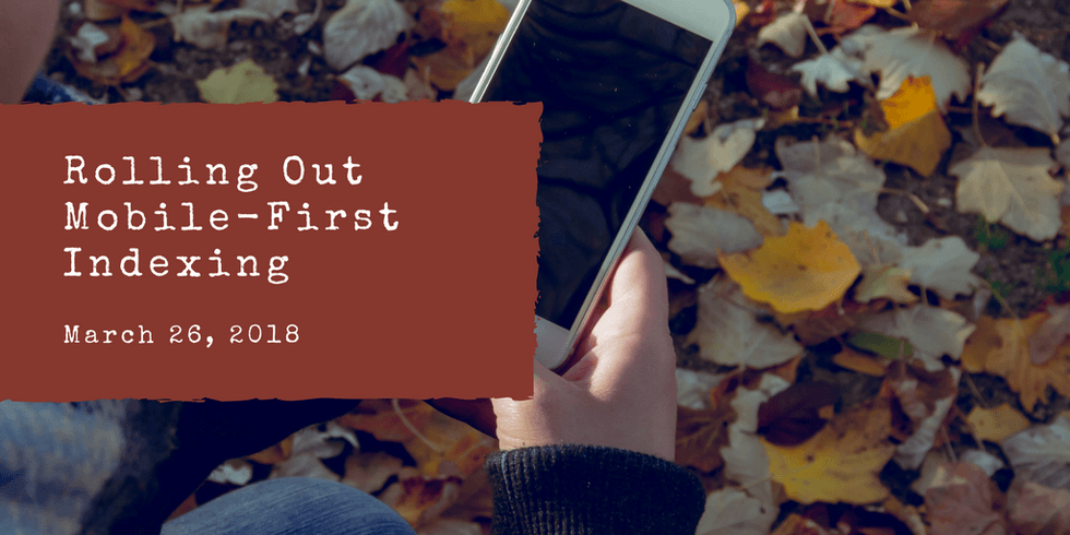 Phone in hand with "Rolling Out Mobile-First Indexing" text, leaves in background.