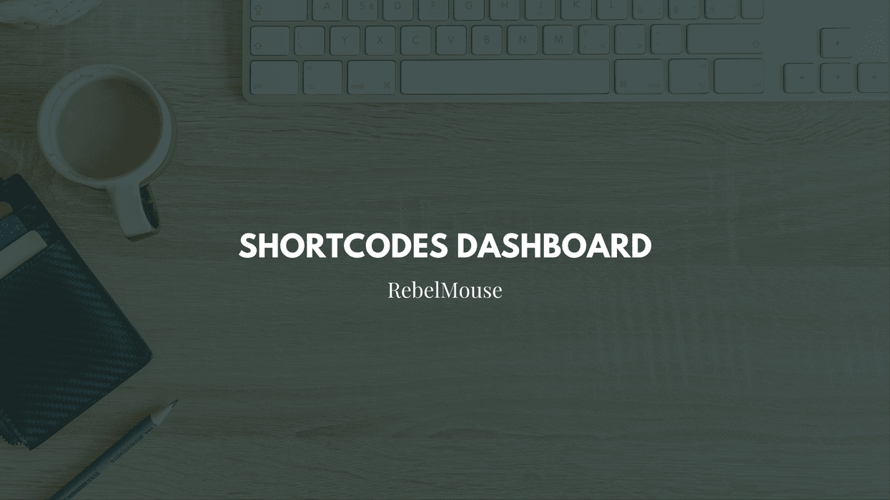 Shortcodes Dashboard by RebelMouse on a wooden desk with keyboard and coffee.