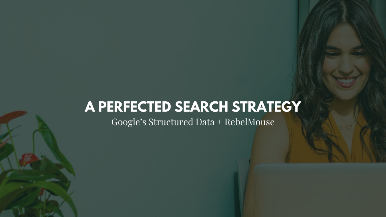 woman smiles while using a laptop